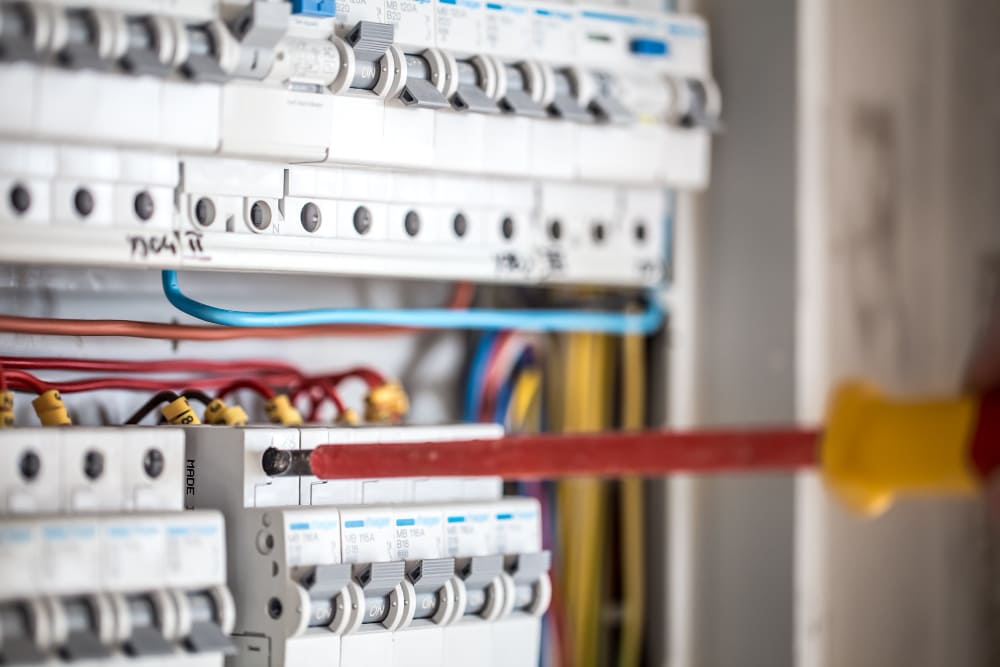 man-electrical-technician-working-switchboard-with-fuses-installation-connection-electrical-equipment-close-up (2) man-electrical-technician-working-switchboard-with-fuses-installation-connection-electrical-equipment-close-up (2)